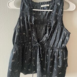 American Eagle Black Sleeveless Top with Bow Pattern